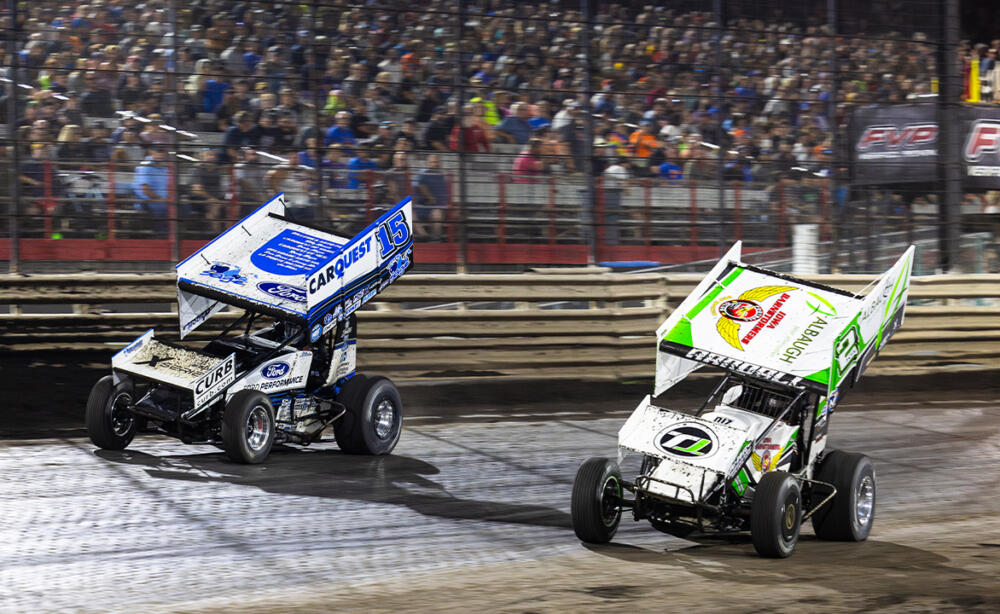 Chase Randall and Donny Schatz race side by side at Knoxville