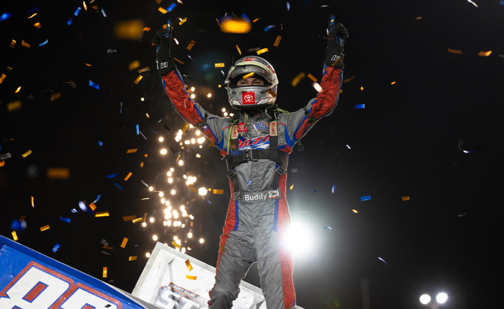 Buddy Kofoid celebrates by climbing all the way atop the Roth Motorsports #83