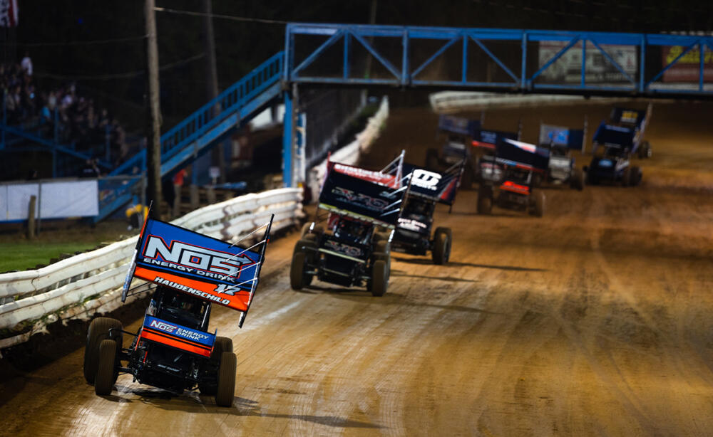 Sprint Cars race down the back straightaway at Williams Grove