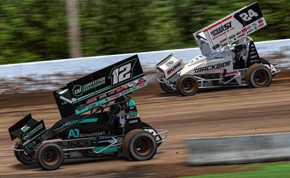 Alex Bergeron drives by Tanner Pettit at Weedsport for the lead