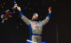 Donny Schatz celebrates with a wing dance and looks toward the sky