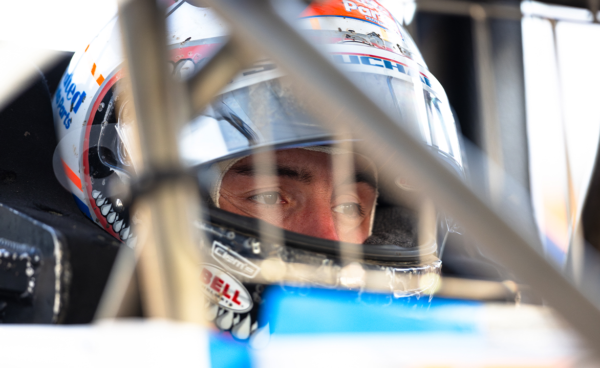 Logan Schuchart sits in the Shark Racing No. 1S