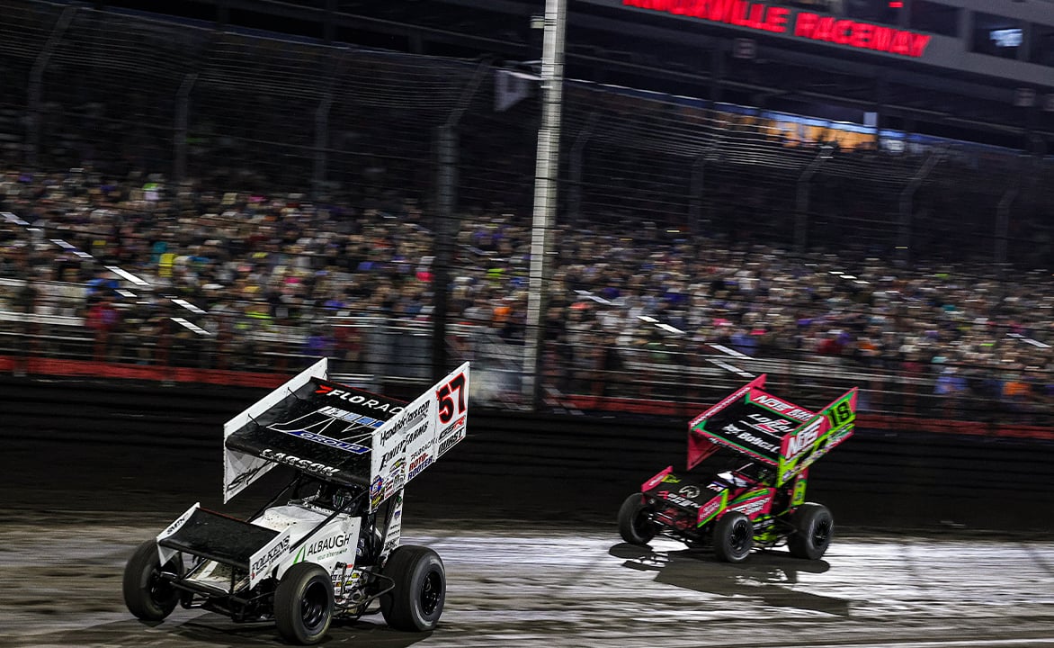 Kyle Larson races ahead of Sheldon Haudenschild at Knoxville Raceway