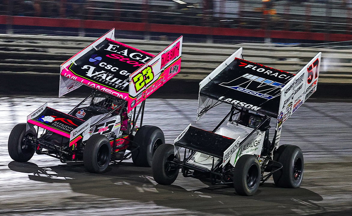 Kyle Larson races alongside Garet Williamson at Knoxville Raceway