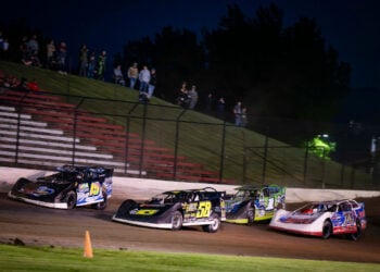 Gustin leading pack of cars