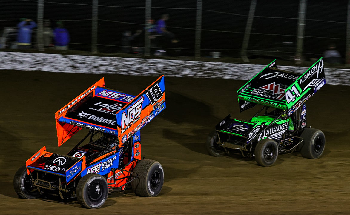Sheldon Haudenschild races ahead of Carson Macedo at Ogivlie Raceway