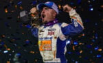 Logan Schuchart celebrating his Ironman 55 win