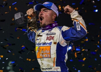 Logan Schuchart celebrating his Ironman 55 win