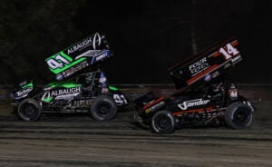 Carson Macedo races ahead of Corey Day at Kings Speedway