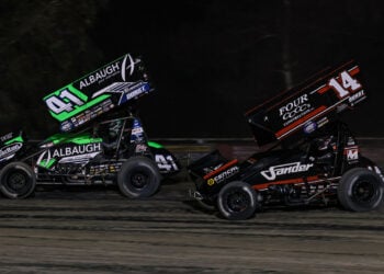 Carson Macedo races ahead of Corey Day at Kings Speedway
