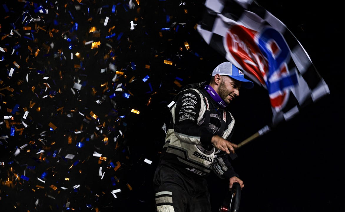 Justin Sanders celebrates with a wing dance at Stockton Dirt Track