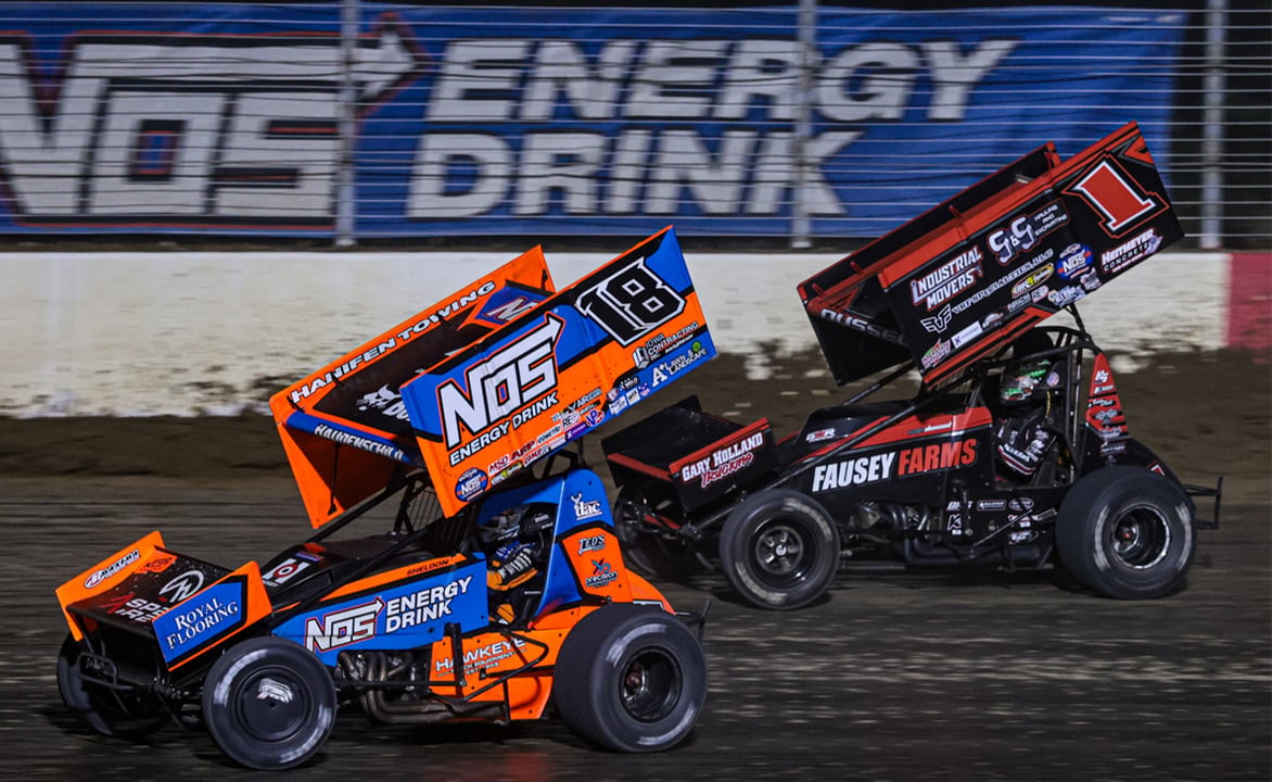 Sheldon Haudenschild drives by Nate Dussel at Mansfield Speedway