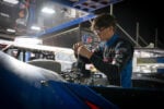 Trey Mills working on car