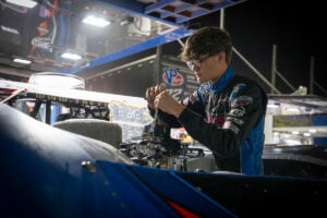 Trey Mills working on car