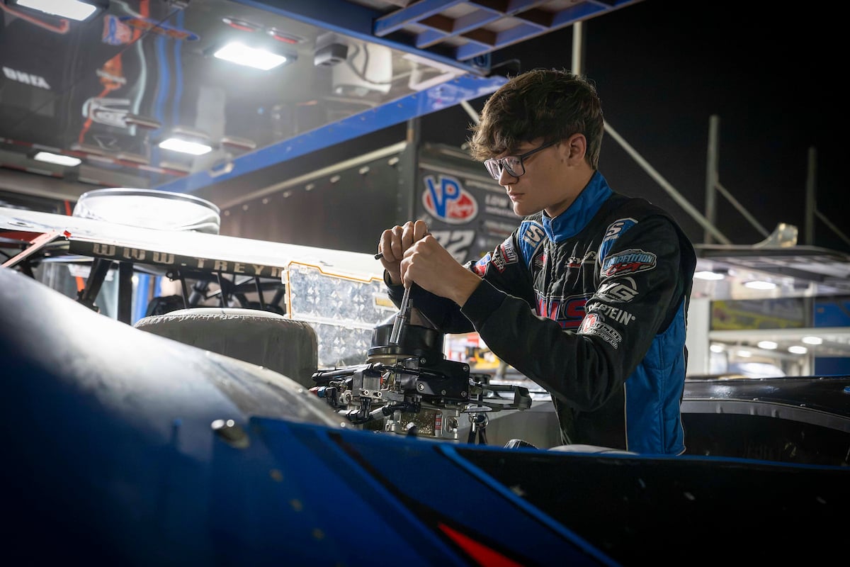 Trey Mills working on car